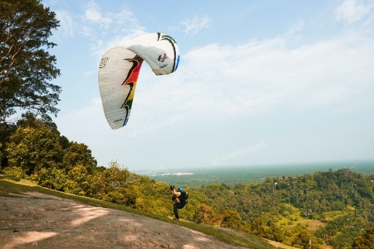 Man Holding Onto Parachute