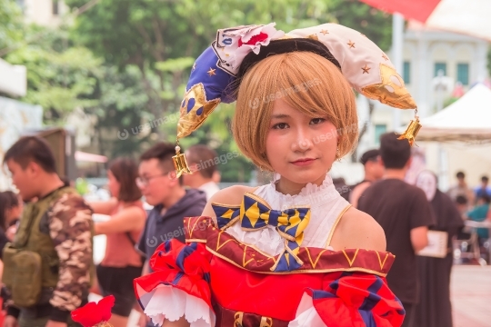 Woman Cosplaying Clown Standing Near People Talking